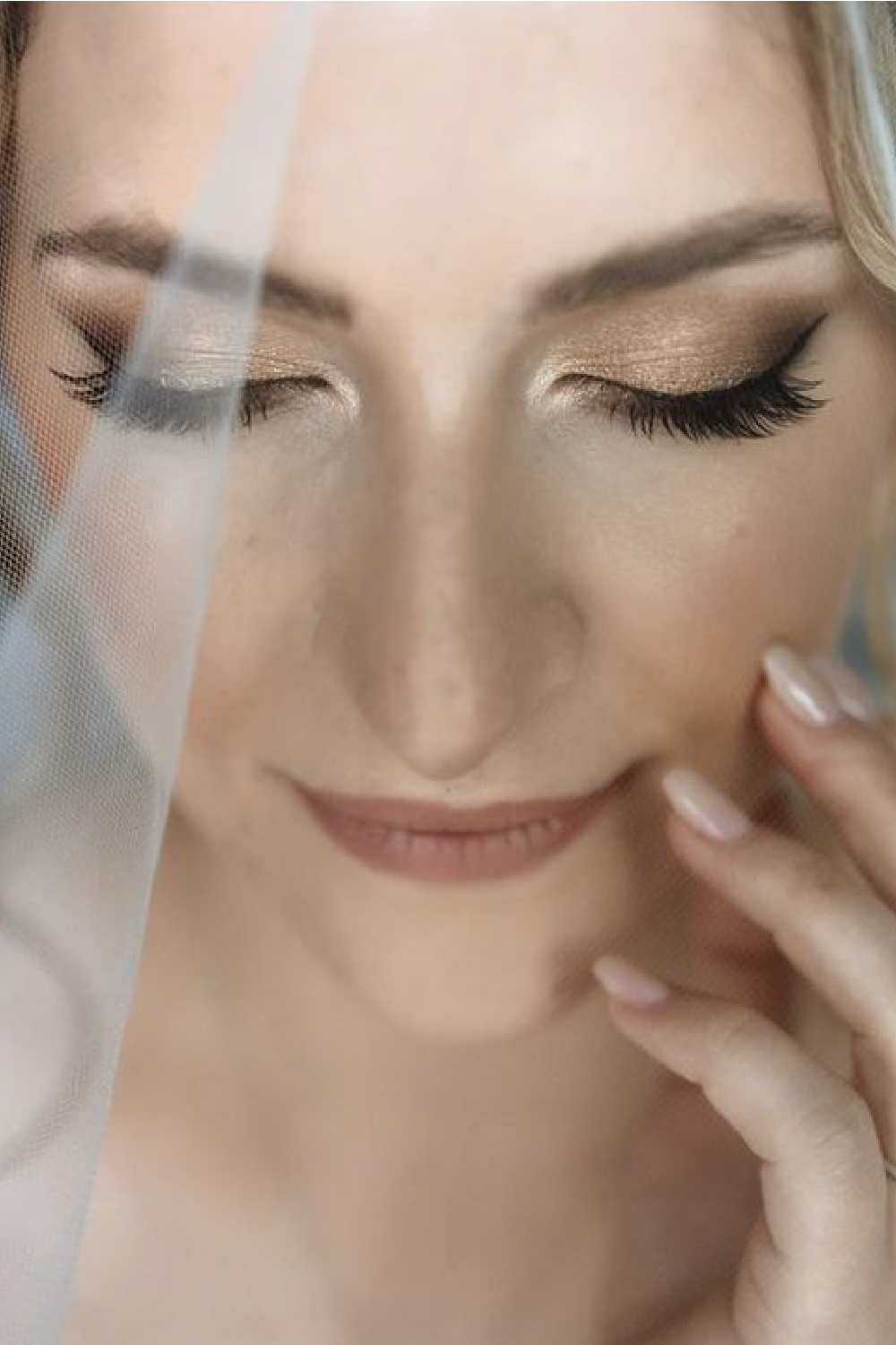 Bridal makeup in golden tones, close up from face